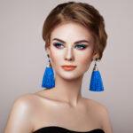 beautiful-woman-with-large-earrings-tassels-97GFJK6.jpg